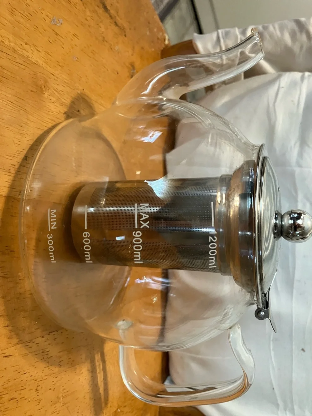 Like new. French press style glass tea pot with stainless steel pieces